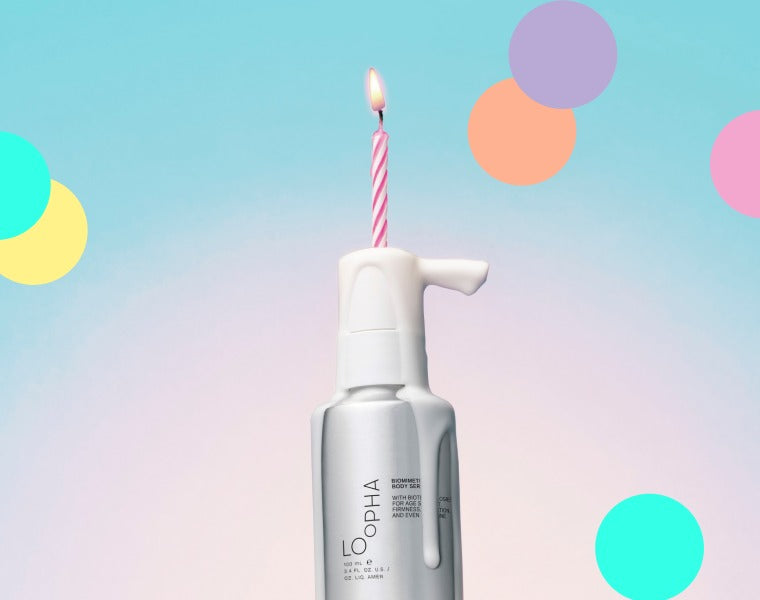 LOoPHA Biomimetic Body Serum with a birthday candle
